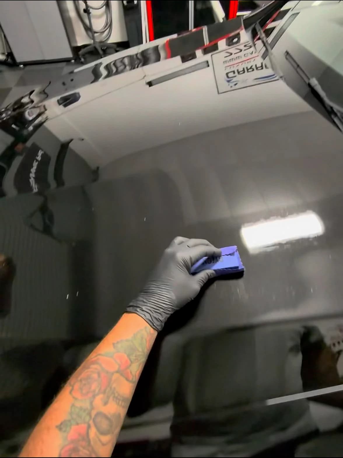 Rod Shine applying a ceramic coating to prepared black paint