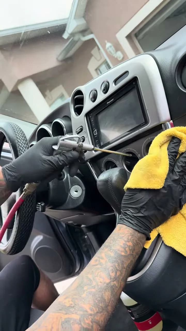 Dashboard being finished during interior detailing